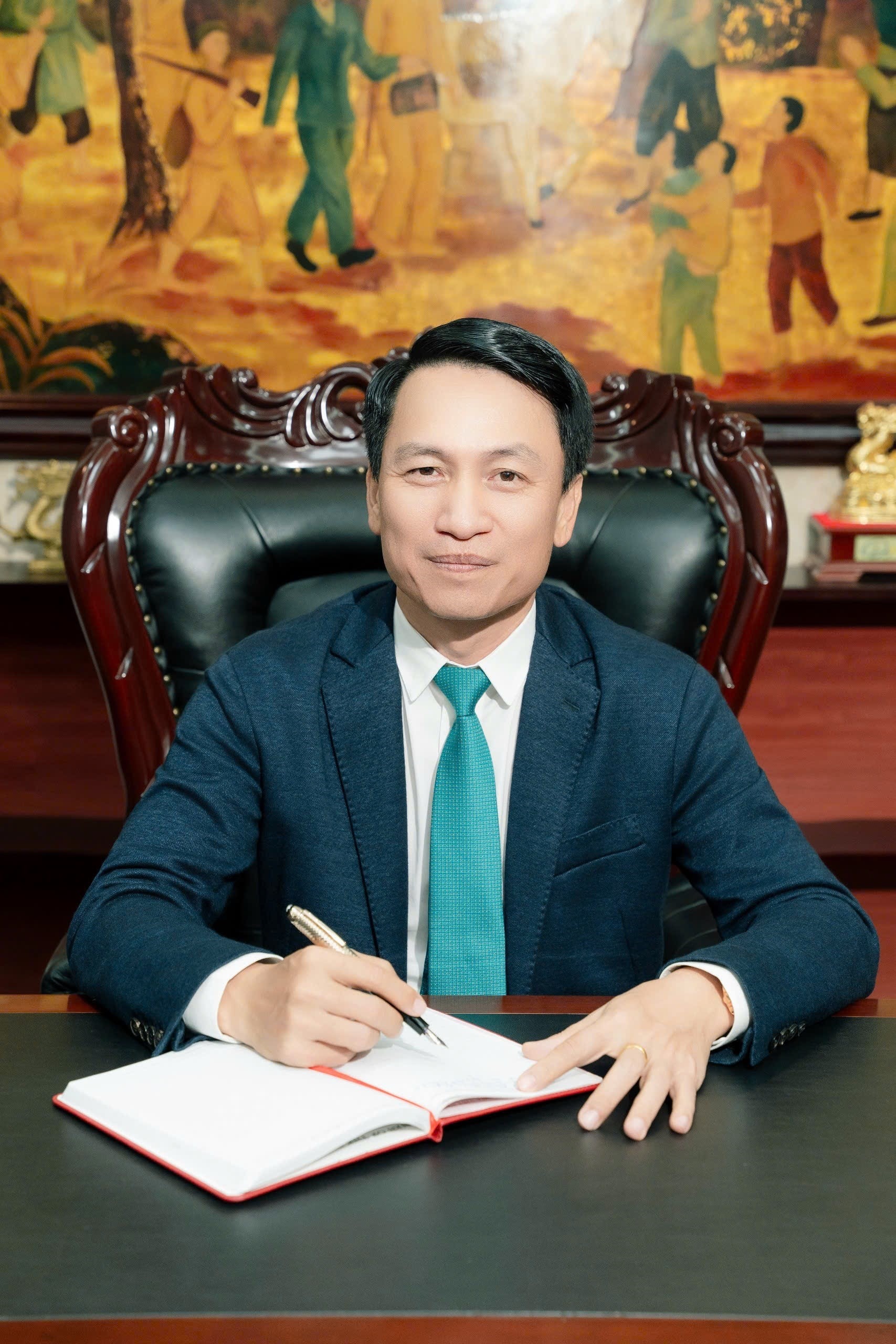 Boss Tien is sitting in the chair.